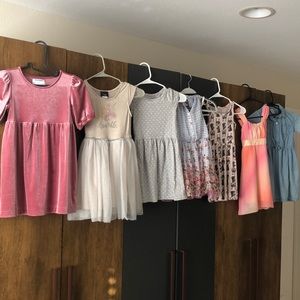 Seven girls dresses (size 6) and one pair of sparkle boots!